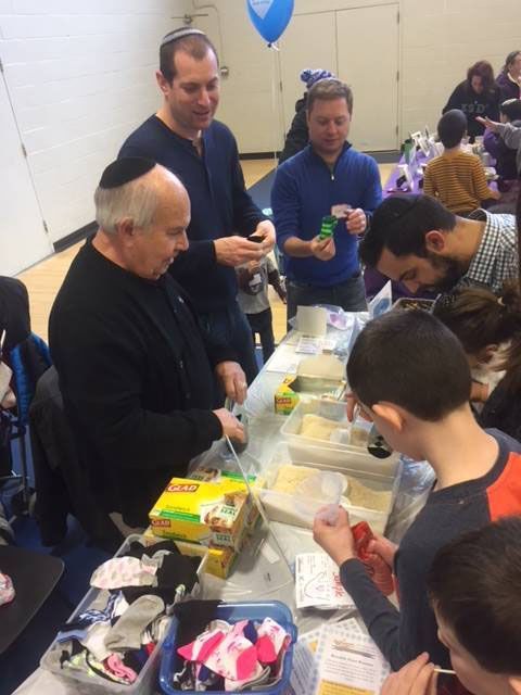 Levinson staff and members of the community participate in Mitzvah Day at the Park Heights JCC