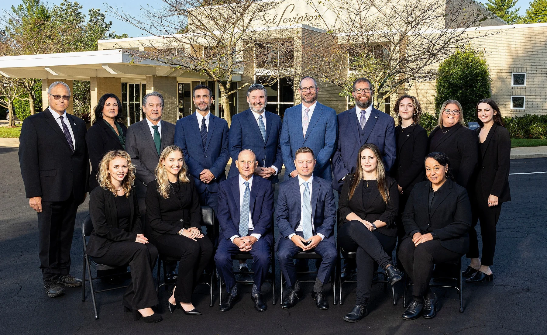 Sol Levinson's funeral directors, assistants and apprentices gathered outside the funeral home.